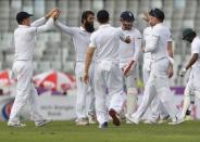 England's Moeen Ali (2nd L) is congratulated by his teammates after taking the wicket of Bangladesh's Mominul Haque. Bangladesh v England - Second Test cricket match - Sher-e-Bangla Stadium, Dhaka, Bangladesh - 28/10/16. REUTERS/Mohammad Ponir Hossain