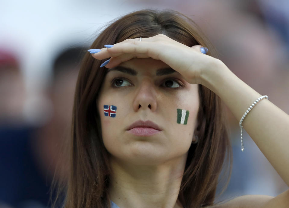 <p>A fan shows her support with face paint </p>