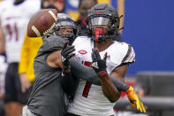 Louisville wide receiver Tutu Atwell (1) can't make a catch as Pittsburgh defensive back A.J. Woods (25) is called for pass interference during the second half of an NCAA college football game, Saturday, Sept. 26, 2020, in Pittsburgh. Pittsburgh won 23-20.(AP Photo/Keith Srakocic)