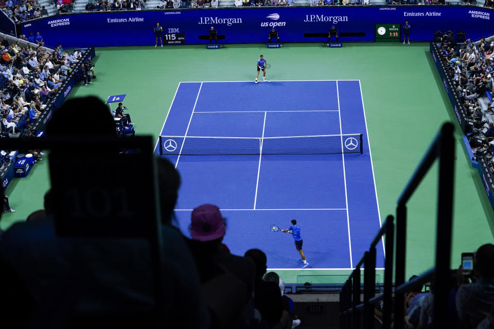 Novak Djokovic, of Serbia, returns to Stan Wawrinka, of Switzerland, during round four of the U.S. Open tennis championships Sunday, Sept. 1, 2019, in New York. (AP Photo/Eduardo Munoz Alvarez)