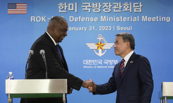 U.S. Secretary of Defense Lloyd Austin, left, shakes hands with South Korean Defense Minister Lee Jong-sup after a joint press conference after their meeting at the Defense Ministry in Seoul, South Korea, Tuesday, Jan. 31, 2023. (Jeon Heon-kyun/Pool Photo via AP)