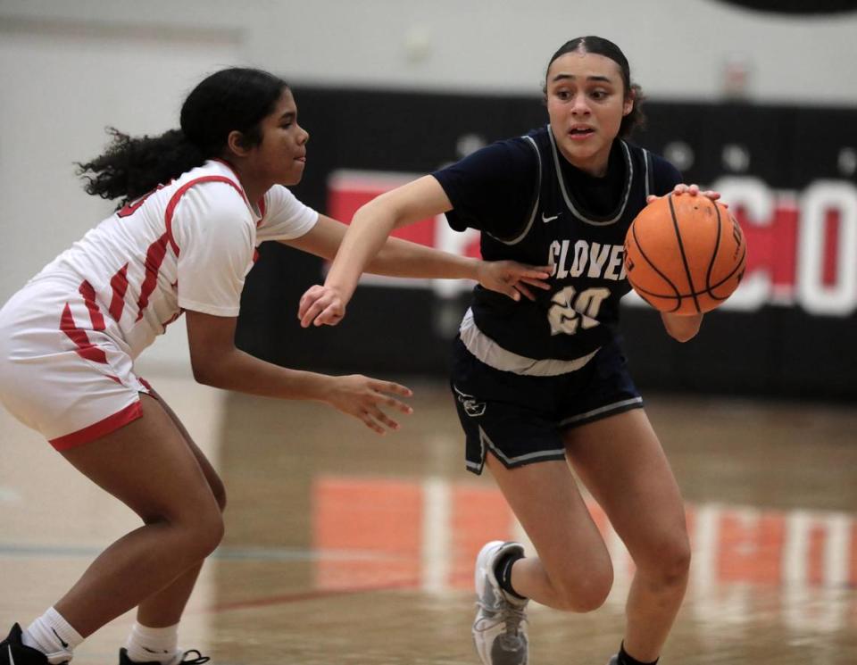 Clover’s Karis Alexander (20) tries to make it past Nation Ford’s Kedra Drakefield as the Blue Eagles and Falcons battle it out in Fort Mill on Friday.