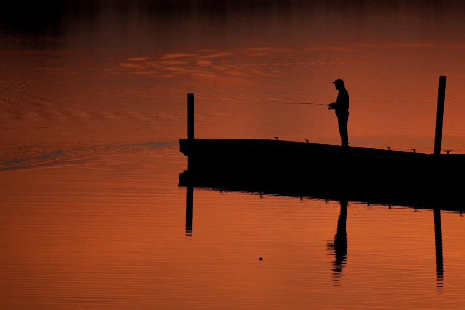 A man fishes on a dock at Shawnee Mission Park&nbsp;in Lenexa, Kansas, on March 11, 2019. (Photo: Charlie Riedel/AP)