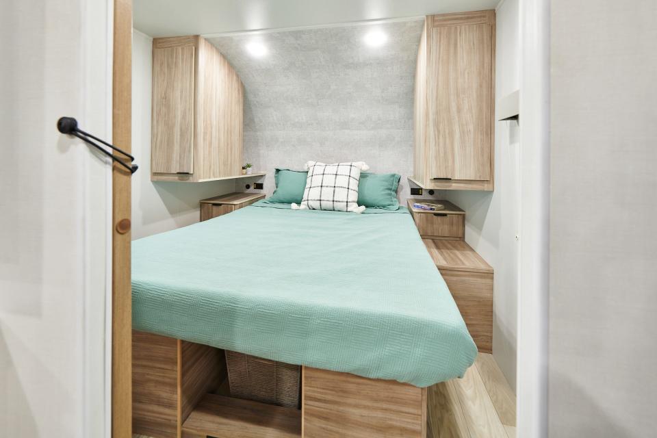 A bed on an elevator platform inside Winnebago's new Access RV