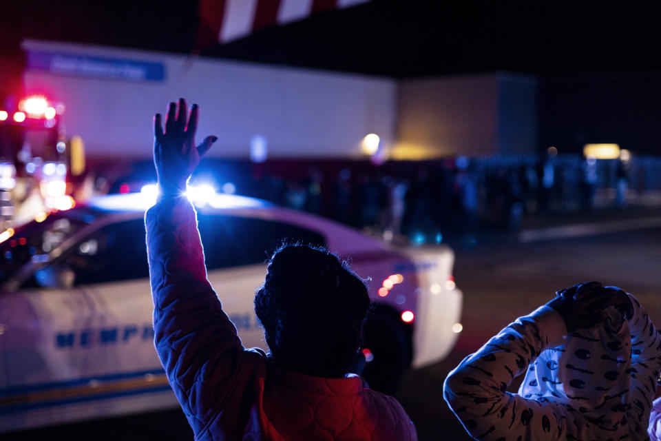 Officers and community members gathered at the beginning of a "Sea of Blue" in honor of fallen officer Geoffrey Redd that directly followed a visitation at Greater Community Temple on Monday, Feb. 27, 2023 in Memphis, Tenn. Redd was shot while responding to a confrontation at a library was remembered at his funeral Tuesday as a strong, proud and dedicated U.S. Marine and public servant. (Brad Vest/Daily Memphian via AP)