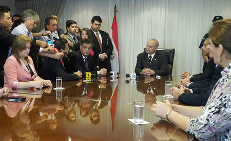 Paraguay's Senate President Roberto Acevedo (3rd L) and Supreme Court President Luis Benitez Riera (C) attend a meeting with other senators at the Justice Building in Asuncion, Paraguay, April 3, 2017. REUTERS/Monica Machicao