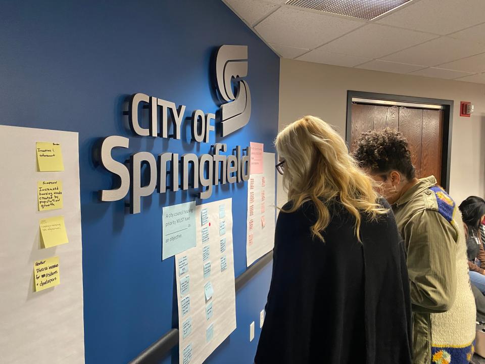 Springfield City Council members Callie Carroll and Heather Hardinger look at other council members' responses to prompts about a City Council priority on housing on Tuesday, Jan. 30, 2024.