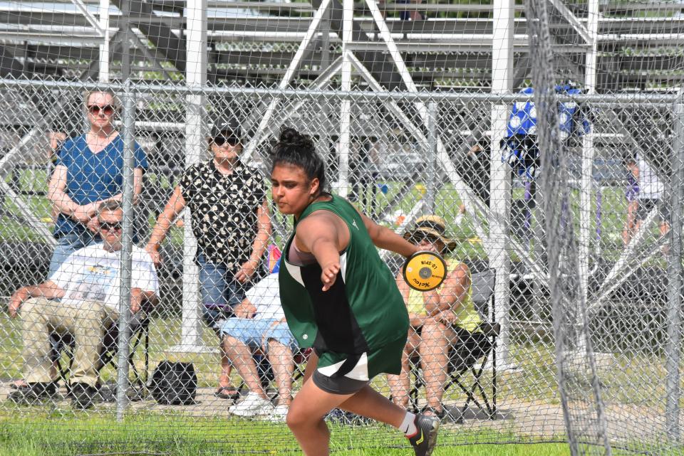 Sand Creek's Emily Carbajal competes in the discus event at the Lenawee County Track and Field Championships.
