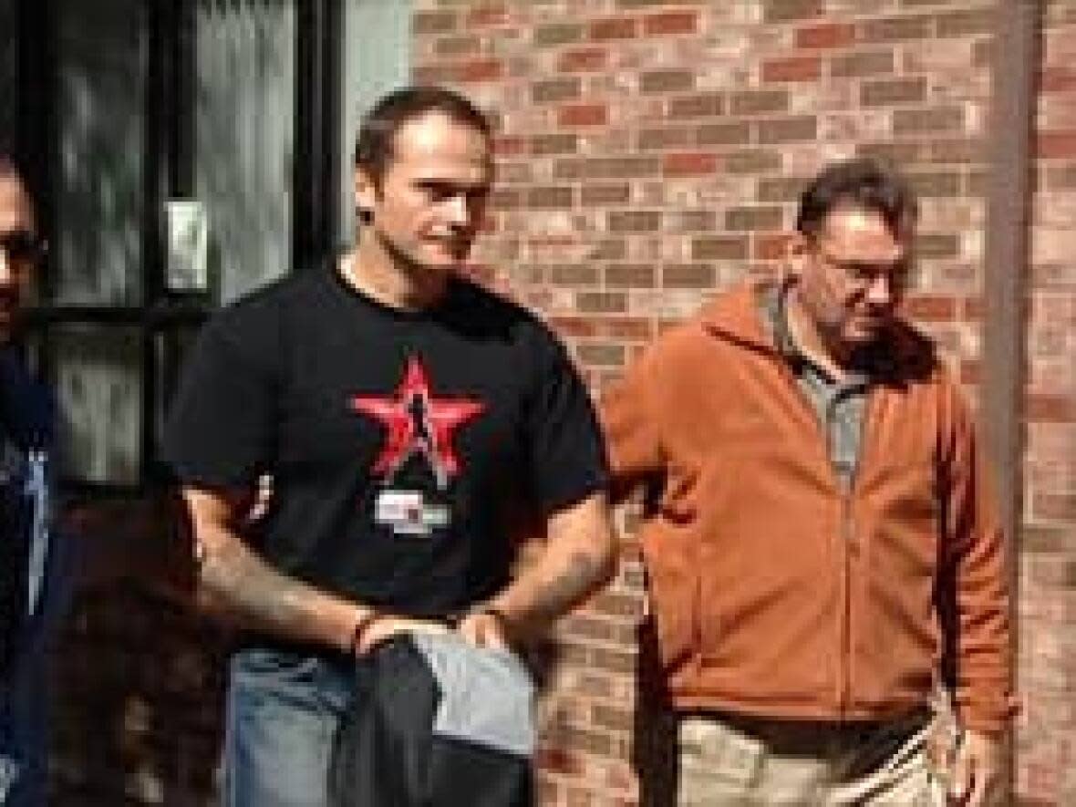 Convicted second-degree murderer Gary Gormley, shown being escorted by officials in a 2008 photo, has been granted day parole.  (CBC - image credit)