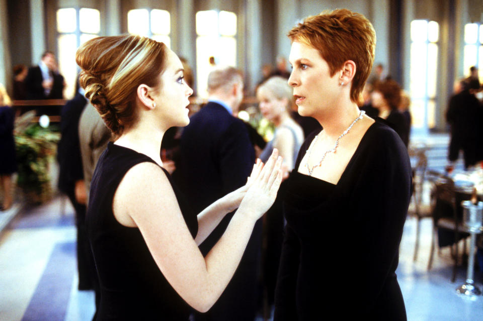 Lindsay Lohan and Jamie Lee Curtis in a scene from the film "Crazy Friday," have an intensive conversation at an event