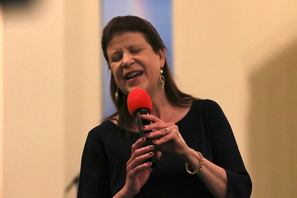 West Side Church of God music director Tracie Nice leads the choir and congregation during the song of adoration, “Great Is Thy Faithfulness,” during the last service on Sunday. Eduardo Castillo /The Wichita Eagle