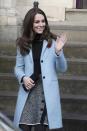 <p>In a light blue Mulberry coat, a black turtleneck, grey tweed Dolce & Gabbana skirt with button and fringe accents, a black leather clutch and black tights while visiting the Nelson Trust Women's Centre in Gloucestershire.</p>