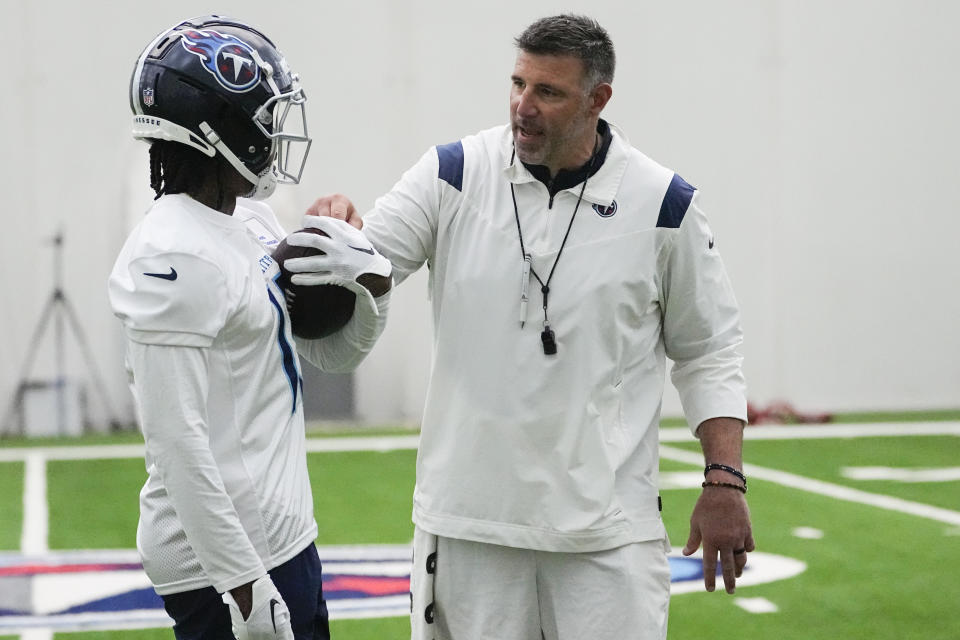 Tennessee Titans wide receiver Jacob Copeland, left, takes instruction from head coach Mike Vrabel during the NFL football team's rookie minicamp, Saturday, May 13, 2023, in Nashville, Tenn. (AP Photo/George Walker IV)