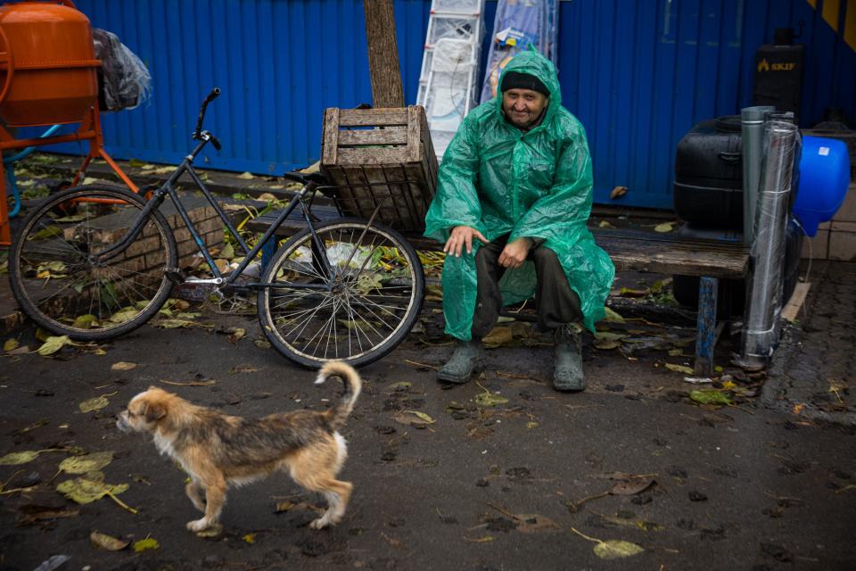 A resident at an open-air market in the outskirts of the town of Bakhmut, Donetsk region in Ukraine on Oct. 25.