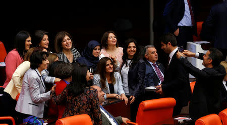 Pro-Kurdish opposition Peoples' Democratic Party (HDP) MPs pose for a group picture during the voting of an article of constitutional change that could see pro-Kurdish and other lawmakers prosecuted, at the Turkish parliament in Ankara, Turkey, May 20, 2016. REUTERS/Umit Bektas