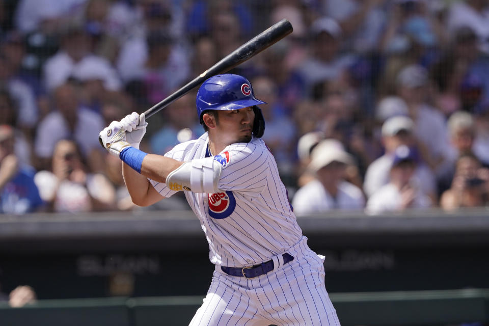 Chicago Cubs' Seiya Suzuki hits during the first inning of a spring training baseball game against the Colorado Rockies, Friday, March 25, 2022, in Mesa, Ariz. (AP Photo/Matt York)