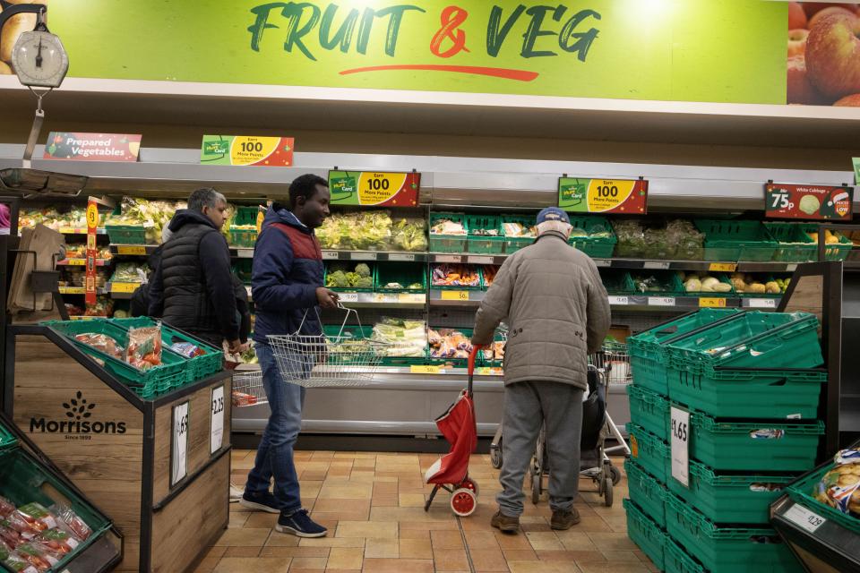 UK food inflation Shoppers at a Fruit & Veg aisle inside a Morrisons supermarket in central London, England, UK