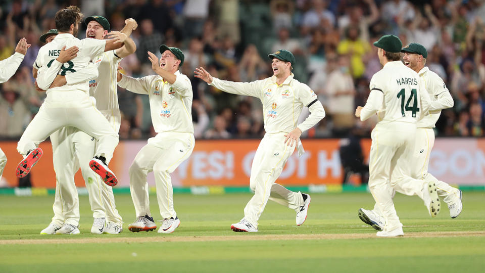 Aussie players, pictured here celebrating after Michael Neser&#39;s first Test wicket.