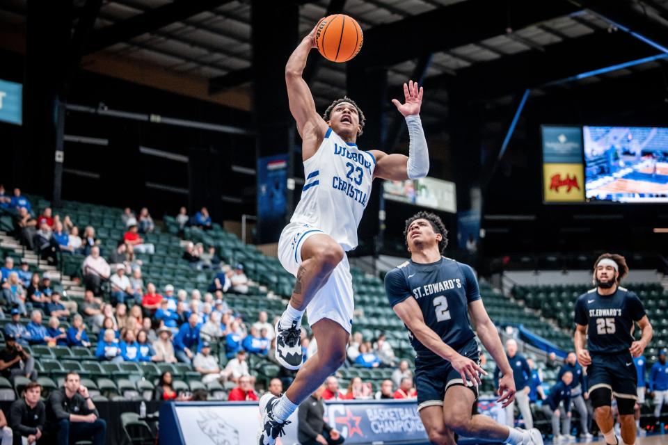 Aamer Muhammad (23) attempts to go up for a basket against St. Edward's during a Lone Star Conference tournament game Thursday, March 3, 2022 at the Comerica Center in Frisco, Texas.