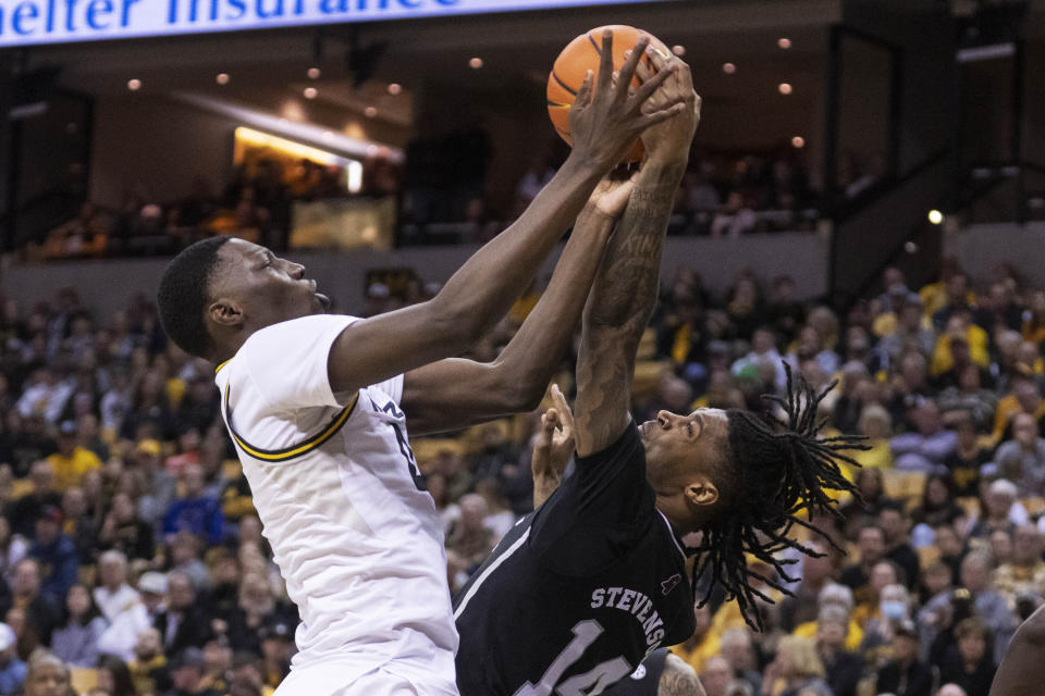 Missouri's Mohamed Diarra, left, and Mississippi State's Tyler Stevenson, right, vie for a rebound during the first half of an NCAA college basketball game Tuesday, Feb. 21, 2023, in Columbia, Mo. (AP Photo/L.G. Patterson)