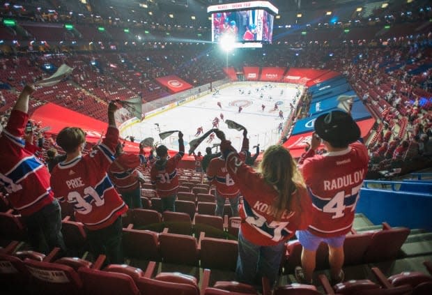 Fans watch the warmup before Game 6 between the Toronto Maple Leafs and the Montreal Canadiens on Saturday at Bell Centre. Quebec's easing of COVID-19 restrictions saw 2,500 mostly partisan fans to attend in the building for the first time in 14 months.  