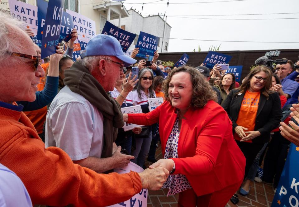 Rep. Katie Porter greets supporters at a campaign event.