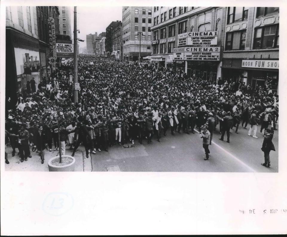 NAACP Youth council Commandos linked arms to restrain the crowd marching down Wisconsin Avenue in a memorial march for Martin Luther King Jr. on April 8, 1968. This photo was published in the Milwaukee Journal on Jan. 4, 1969.