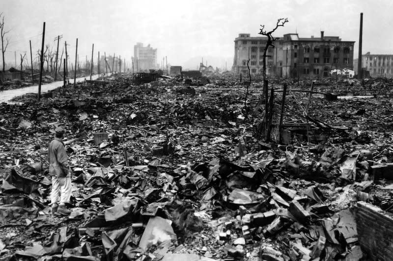An unidentified newsman stands amid the rubble of Hiroshima in September 1945, a month after the atomic bomb was dropped on the city. On August 8, 1945, the Soviet Union declared war on Japan, two days after an atomic bomb was dropped on Hiroshima and several days before Tokyo surrendered. UPI File Photo