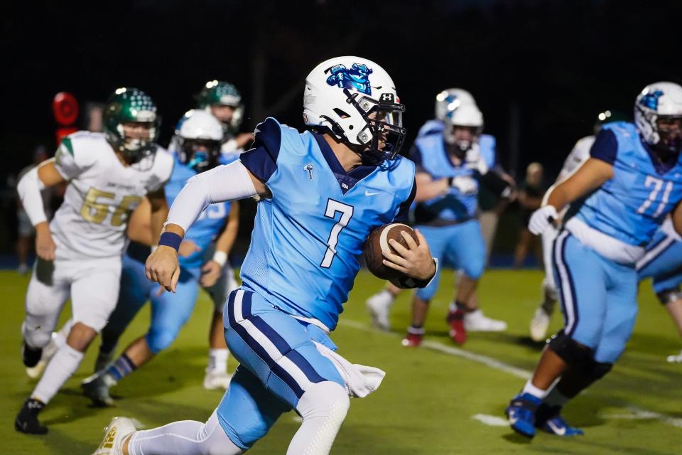 Out-of-Door Academy quarterback Jack Hobson runs up field during Friday night's game against St. Stephen's Episcopal.