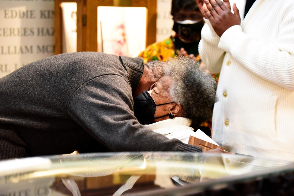 Port Huron NAACP President Kevin Watkins embraces Marguerite Stanley after being named an honoree to the Stanley Legacy Wall during the James Sr. and Marguerite Stanley Legacy Wall honoree ceremony held at the Port Huron Museum Carnegie Center in Port Huron on Saturday, Feb. 26, 2022.