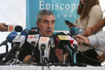 President of the Chilean Episcopal Conference, monsignor Santiago Silva, speaks to the media after receiving Pope Francis' letter stating, that the pope may summon Chile's bishops to Rome for a meeting on the country's sexual abuse crisis, in Punta de Tralca, Chile, April 11, 2018. REUTERS/Stringer