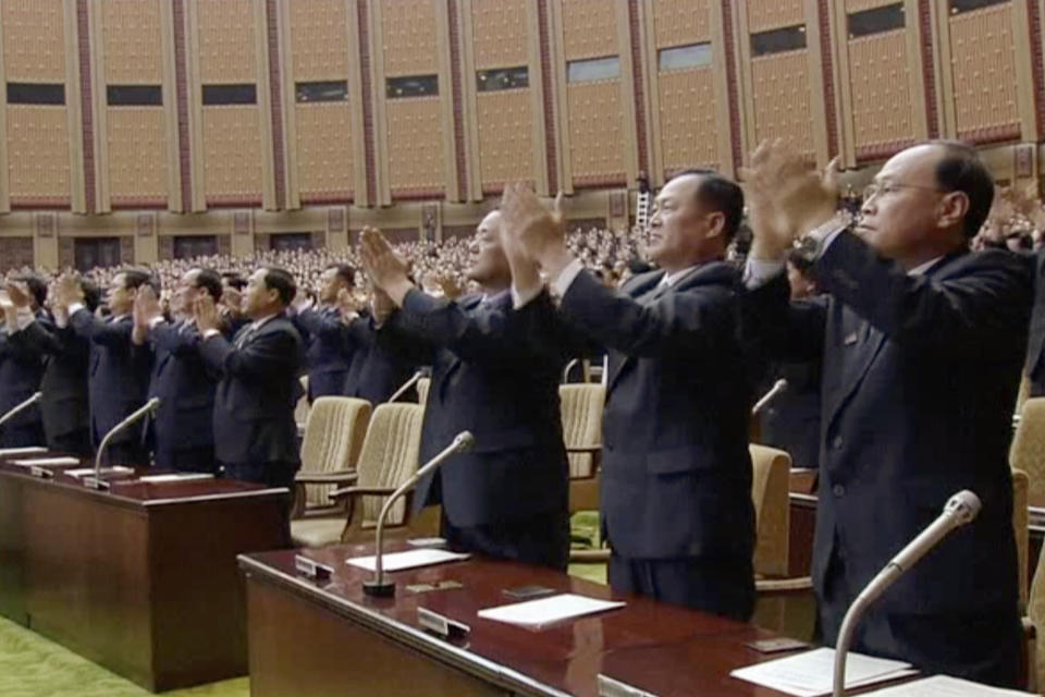 In this image made from video released on Tuesday, April 11, 2017, by North Korean broadcaster KRT, officials stand and applaud as North Korean leader Kim Jong Un presides over parliament in Pyongyang, North Korea. North Korea's parliament convened with Kim Jong Un taking the center seat. The Supreme People's Assembly normally meets once or twice a year at the Mansudae Assembly Hall in central Pyongyang. (KRT via AP)