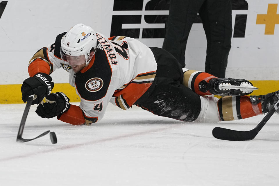 Anaheim Ducks defenseman Cam Fowler (4) passes the puck to a teammate during the second period of an NHL hockey game against the Nashville Predators, Tuesday, Nov. 14, 2023, in Nashville, Tenn. (AP Photo/George Walker IV)