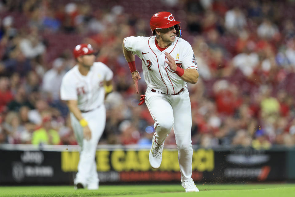 Cincinnati Reds' Spencer Steer scores a run on a walkoff hit by Jonathan India during the ninth inning of a baseball game against the Colorado Rockies in Cincinnati, Friday, Sept. 2, 2022. (AP Photo/Aaron Doster)