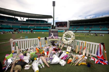 Tributes to Australian cricketer Phillip Hughes are displayed on the pitch at the Sydney Cricket Ground (SCG) December 3, 2014. REUTERS/David Gray/File photo