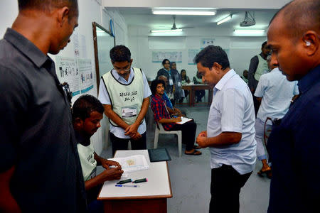 Maldives President Abdulla Yameen prepares to cast his vote at a polling station during the presidential election in Male, Maldives September 23, 2018. President Media//Handout via REUTERS.