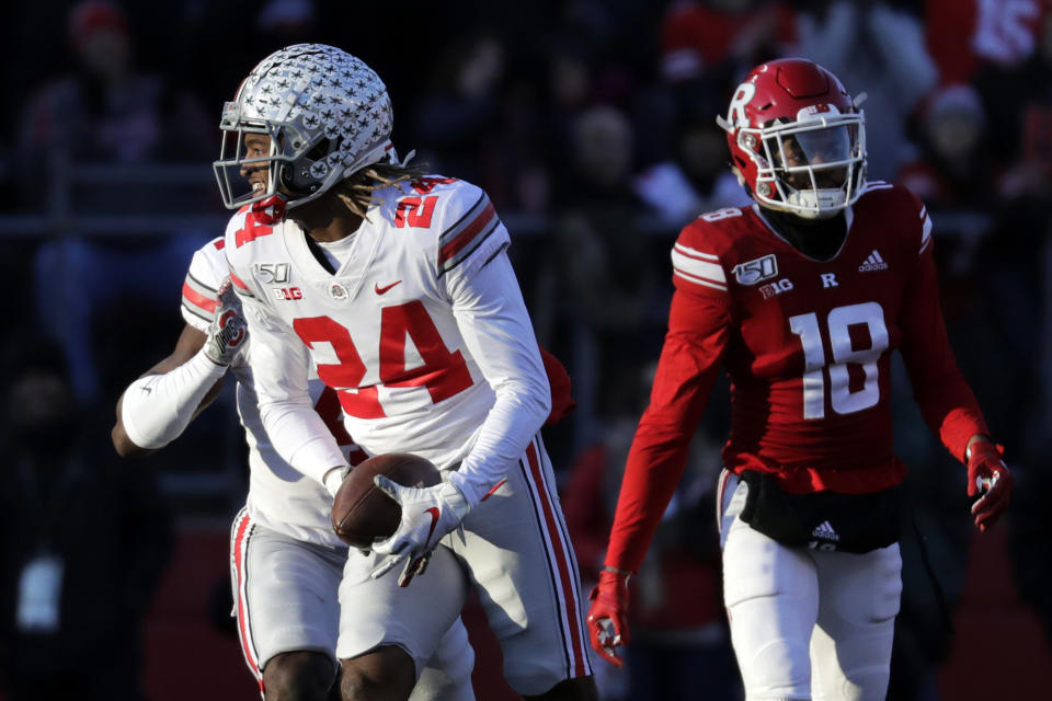 FILE- In this Nov, 16, 2019, file photo, Ohio State cornerback Shaun Wade (24) reacts after making an interception during the first half of an NCAA college football game against Rutgers in Piscataway, N.J. Wade was selected to The Associated Press preseason All-America first-team, Tuesday, Aug. 25, 2020. (AP Photo/Adam Hunger, File)