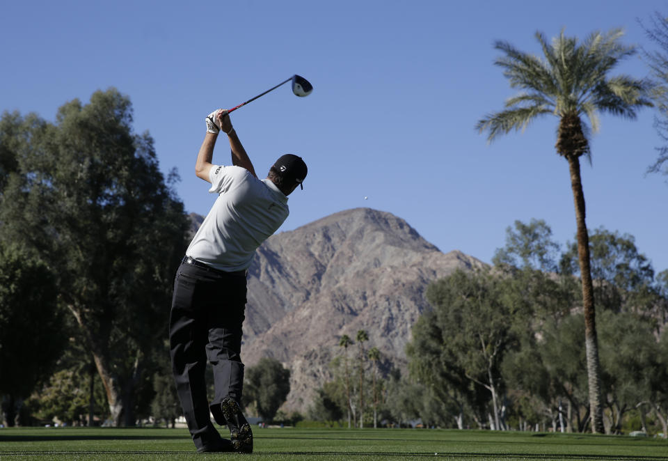 Ryan Palmer watches his tee shot on the 17th hole during the second round of the Humana Challenge golf tournament at La Quinta Country Club on Friday, Jan. 17, 2014, in La Quinta, Calif. (AP Photo/Chris Carlson)