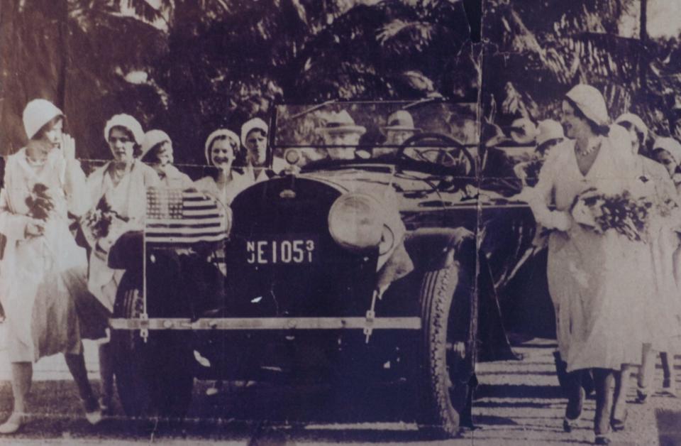 Virginia Sheppard, right, the first queen of the Edison Festival of Light, escorts Thomas Edison's vehicle as one of her royal duties in 1938.