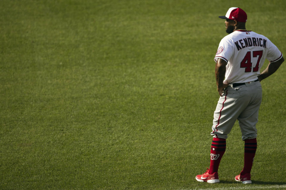 Washington Nationals designated hitter Howie Kendrick stands on the field before a baseball intrasquad game at Nationals Park, Thursday, July 16, 2020, in Washington. (AP Photo/Alex Brandon)