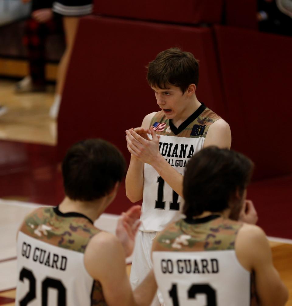 Seton sophomore Andrew Warner claps as starting lineups are announced before a game against Lincoln Feb. 19, 2022, at Earlham College.