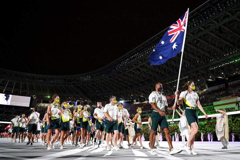 Flag bearers Cate Campbell and Patty Mills of Team Australia lead their team out during the Opening Ceremony of the Tokyo 2020 Olympic Games