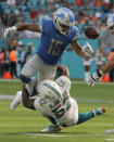 <p>Detroit Lions wide receiver Golden Tate (15) fumbles the ball on a tackle by Miami Dolphins linebacker Raekwon McMillan (52), during the second half of an NFL football game, Sunday, Oct. 21, 2018, in Miami Gardens, Fla. (AP Photo/Lynne Sladky) </p>