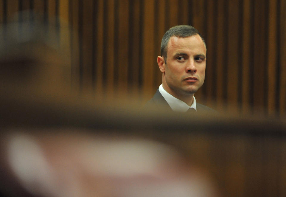 Oscar Pistorius sits in high court in Pretoria, South Africa, Monday, March 24, 2014. The trial of Pistorius, who is charged with murder for the shooting death of his girlfriend Reeva Steenkamp on Valentines Day in 2013, is beginning its fourth week. (AP Photo/Ihsaan Haffejee, Pool)