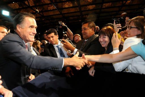 Republican presidential candidate Mitt Romney greets supporters June 21, in Lake Buena Vista, Florida. US President Barack Obama, renowned as a champion fundraiser who piled up $750 million in 2008, warned supporters he would be outspent by Romney in this year's election