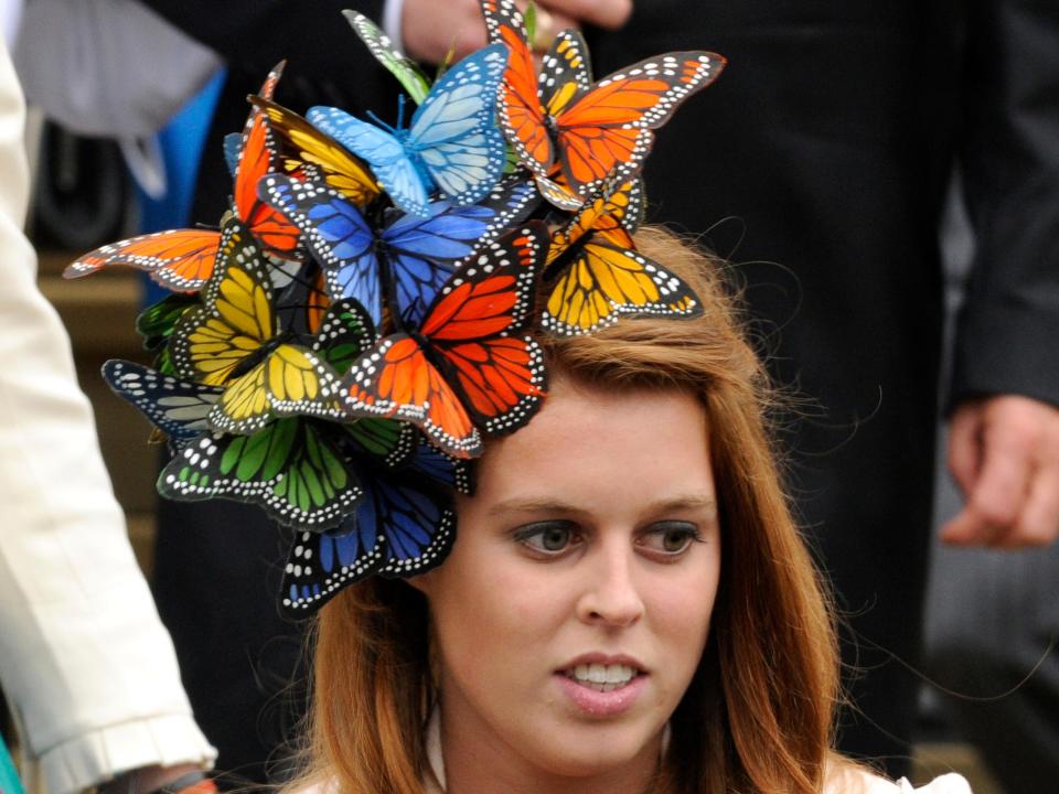 Princess Beatrice wears a fascinator with butterflies on it.