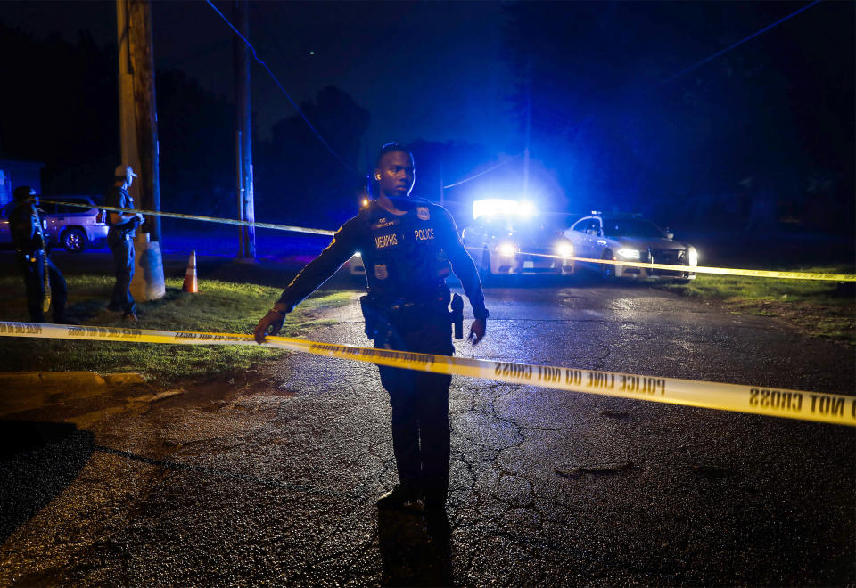 Memphis police officers search an area where a body had been found in South Memphis, Tenn., near Victor Street and East Person Ave., Monday, Sept. 5, 2022. Police in Tennessee said Tuesday, Sept. 6, they had found the body of a Memphis woman abducted during a pre-dawn run, confirming fears that Eliza Fletcher was killed after she was forced into an SUV on Friday morning. Cleotha Abston has been charged with kidnapping and murder in the case. (Mark Weber/Daily Memphian via AP)