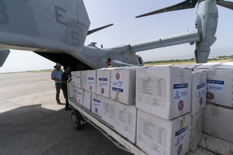 Hygiene Kits are loaded onto a VM-22 Osprey at Toussaint Louverture International Airport, Saturday, Aug. 28, 2021, in Port-au-Prince, Haiti. The VMM-266, "Fighting Griffins," from Marine Corps Air Station New River, from Jacksonville, N.C., are flying in support of Joint Task Force Haiti after a 7.2 magnitude earthquake on Aug. 22, caused heavy damage to the country. (AP Photo/Alex Brandon)