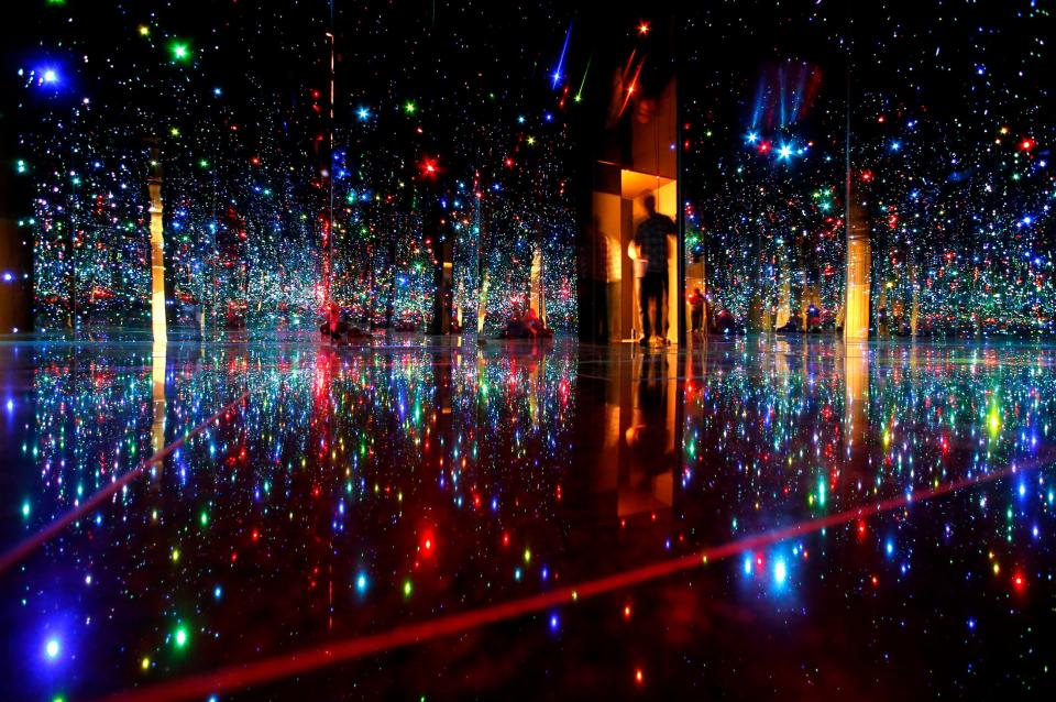 Yayoi Kusama's "You Who Are Getting Obliterated in the Dancing Swarm of Fireflies", is enjoyed by art lovers at the Phoenix Art Museum on January 18, 2014.