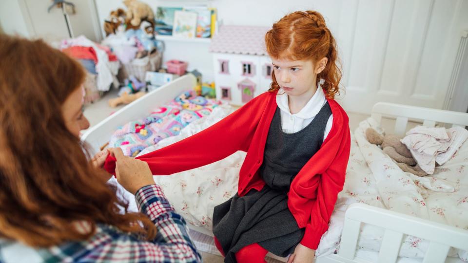 kids in school uniform looking unsure